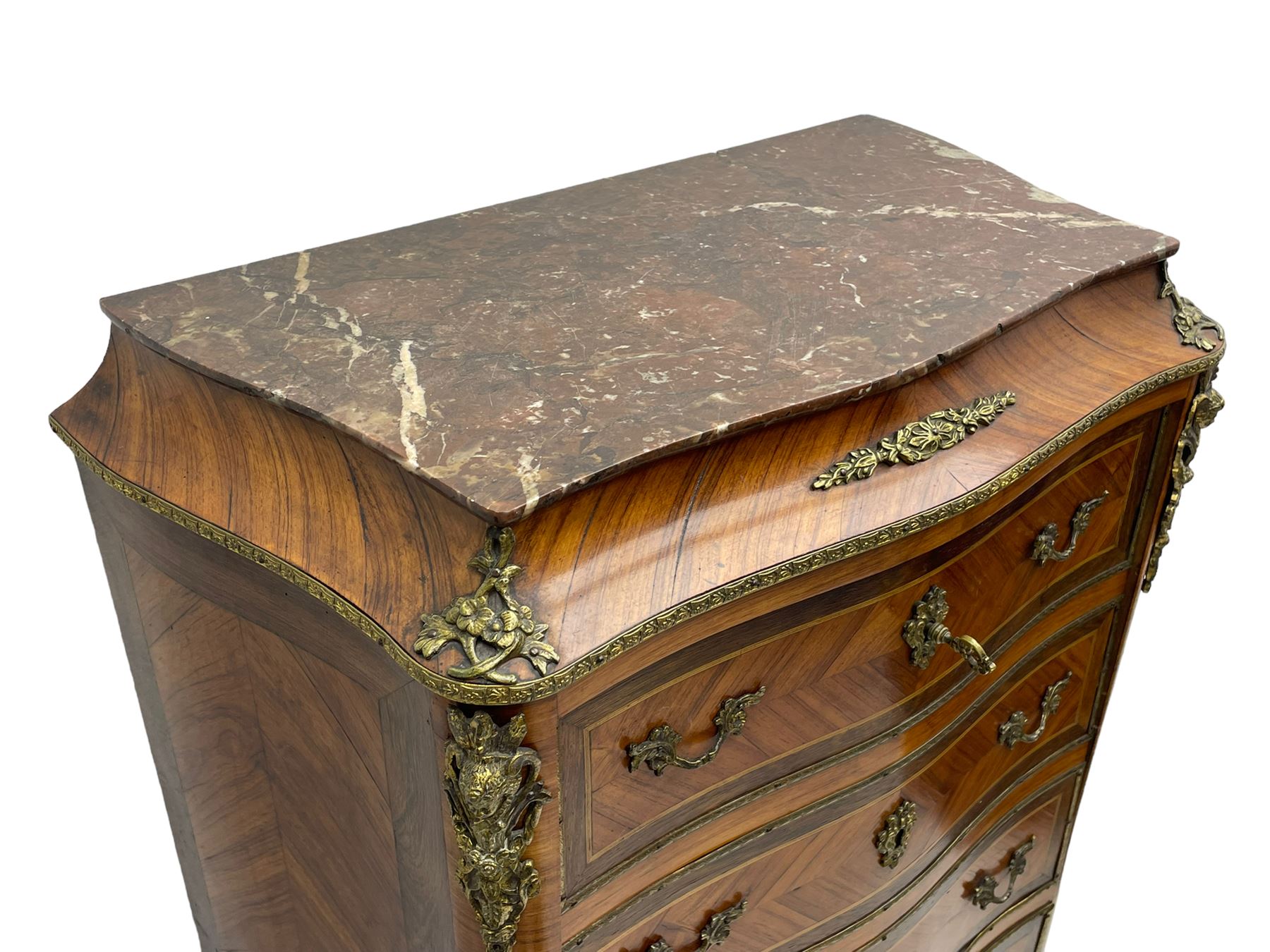 Mid-20th century Louis XVI design Kingwood and walnut secretaire à Abattant, shaped serpentine form with dark rouge variegated marble top, the fall front disguised as three drawers enclosing birdseye maple interior with shelf, drawers and writing surface, four functioning drawers below, decorated with cast gilt metal mouldings and mask cartouches, on skirted base with egg and dart moulded gilt metal edge