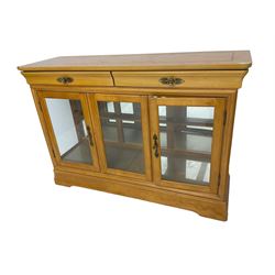 Yew wood sideboard, rectangular top with mahogany and ebony stringing, fitted with two drawers over three glazed cupboard doors enclosing glass shelves