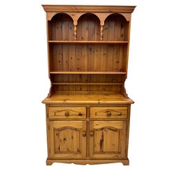 Solid pine kitchen dresser, fitted with plate rack above two drawers and two cupboards