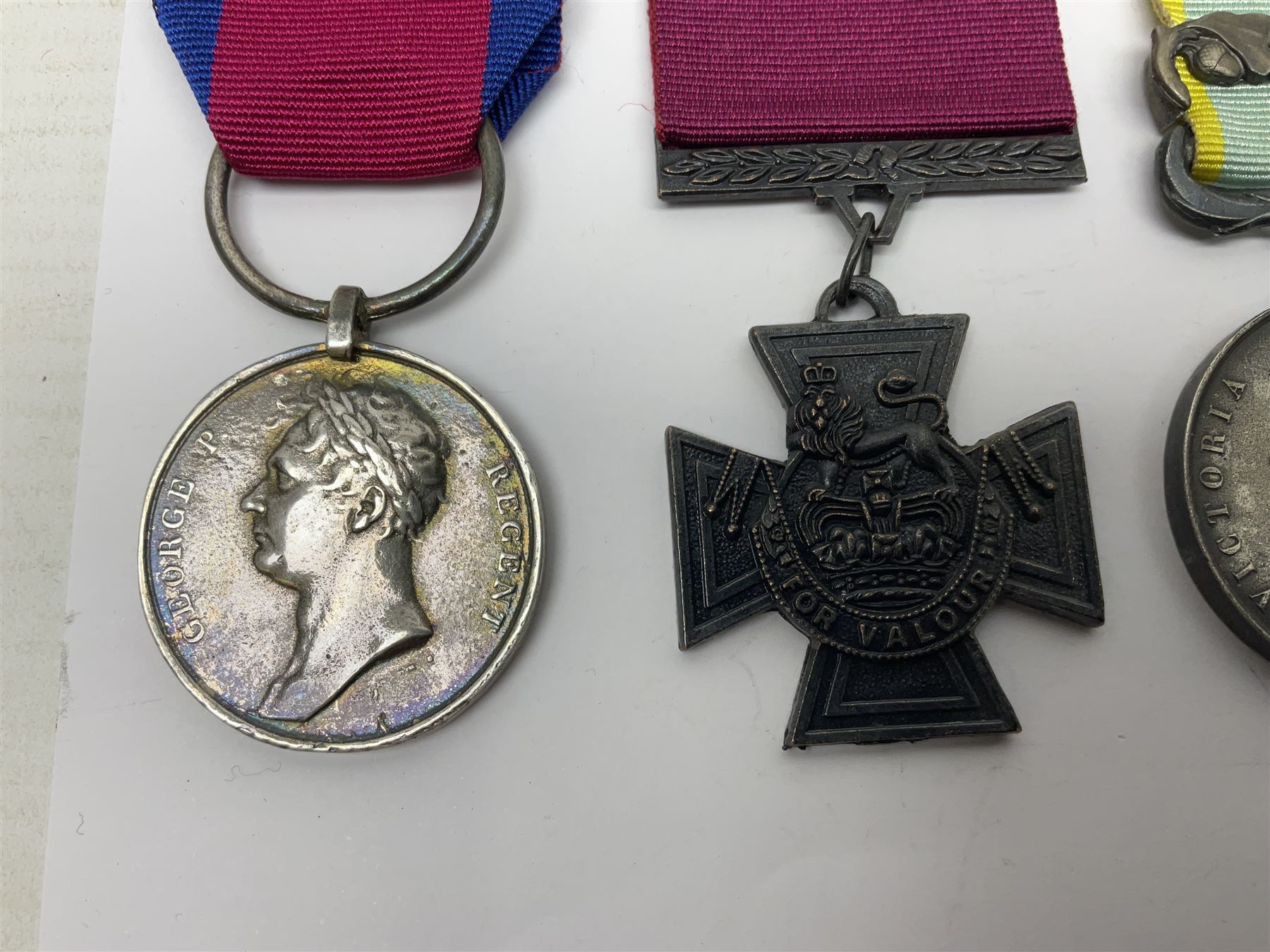 Seven copies of early medals - Waterloo, Crimea, Mediterranean, China 1900, Victoria Cross, Natal Rebellion and Tibet 1903-4; all with ribbons (7)
