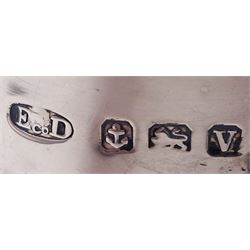 1920s silver hot water pot, of part fluted baluster form, with gadrooned girdle and rim and ebonised handle and finial, upon four bun feet, hallmarked Ernest Druiff & Co, Birmingham 1920