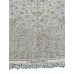 Persian Mahal densely knotted ivory ground carpet, floral rosette medallion surrounded by interlacing leafy branches and palmettes, scrolling border decorated with foliate motifs, within guard stripes, with signature panels to each end