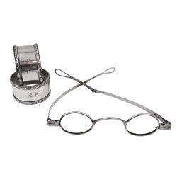 Pair of Georgian silver spectacles, with extending arms, hallmarked John Parkes, no date mark, with lion passant, anchor and King's head, together with a pair of modern silver napkin rings, with beaded rim and engraved initials to body, hallmarked Bishton's Ltd, Birmingham 1967