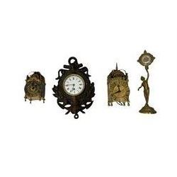Three mantle clocks and a wall clock