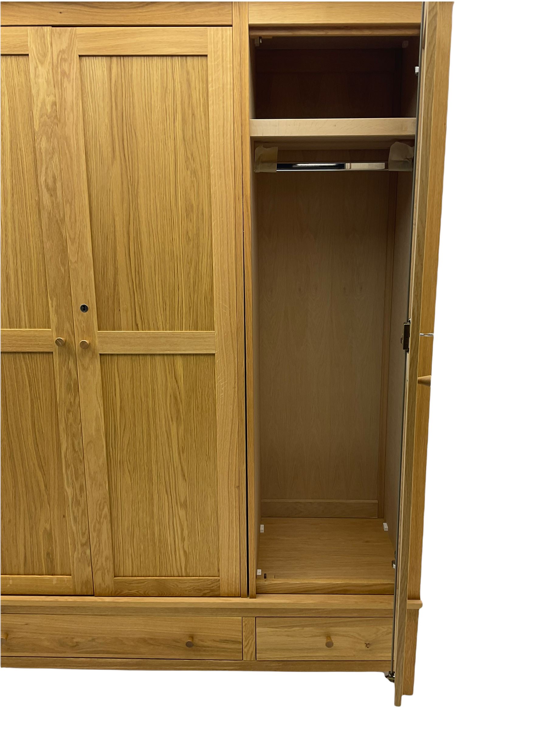 Corndell Furniture - light oak triple wardrobe, enclosed by three panelled doors, one long and one short drawer