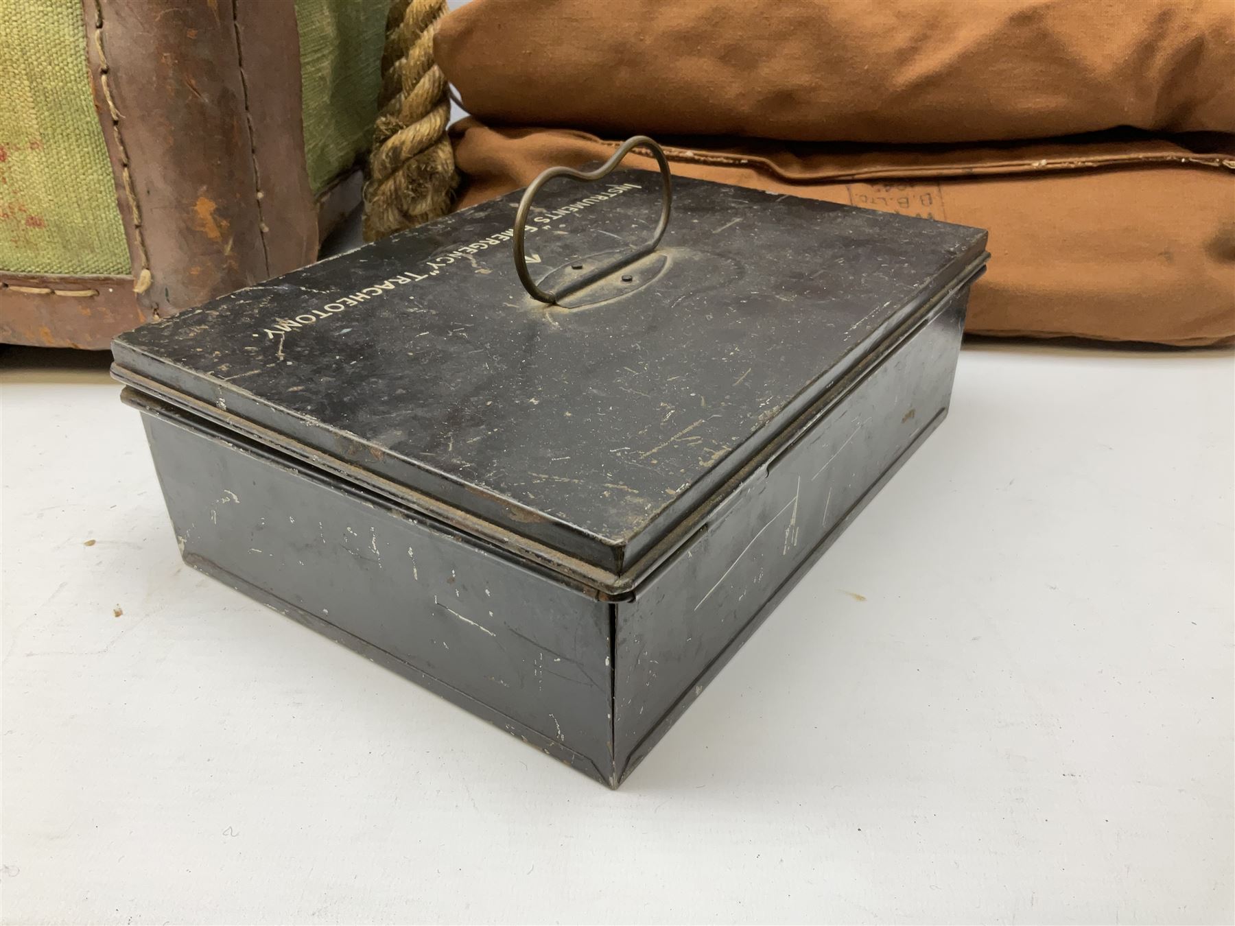 WW2 British Army RAMC 'Regimental Medical Pannier', well marked externally and dated 1941, stamped May 1943 internally, canvas covered wicker form with leather edges, hinged top and fall front with two rope carrying handles, fitted iron locking straps with securing chains; contains various unused field dressings and bandages with WW2 dates and two pillows; original label under lid L79cm