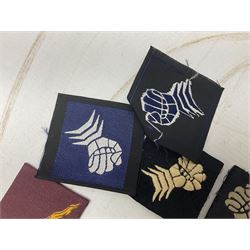 Approximately one-hundred printed and embroidered cloth badges including Royal Tank Regiment, Royal Armoured Corps, 219th Independent Infantry Brigade, Cyrenaica, Cyprus, Singapore and other districts, Gibraltar Garrison, East Anglian Brigade, 20th Armoured Brigade and various armoured divisions etc