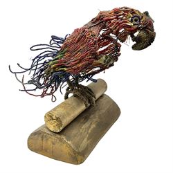 Victorian bead and wire model of a parrot, of polychrome beads, with glass eyes, on a wooden base, H24cm