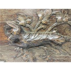 Pair of oak furniture door panels, carved in relief with a fox to one and a hound to the other, together with a pair of smaller oak panels, carved in relief with a hare to one and a grouse to the other, doors W63.cm x H62cm, panels W43cm x H60cm