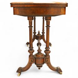 Victorian walnut and inlaid games table, rectangular fold-over top with figured walnut veneers and foliate inlay, swivel and fold over to reveal a green baize lined playing surface, on twin supports united by a stretcher, raised on scroll carved feet with castors (extended 96cm x 92cm)