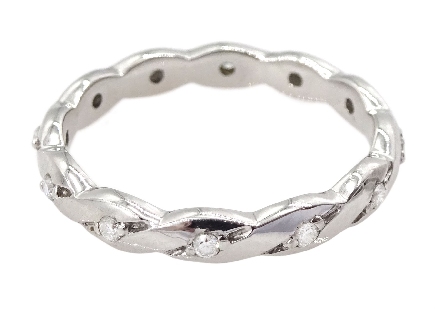 18ct white gold diamond full eternity ring, crossover set with twelve round brilliant cut diamonds, hallmarked