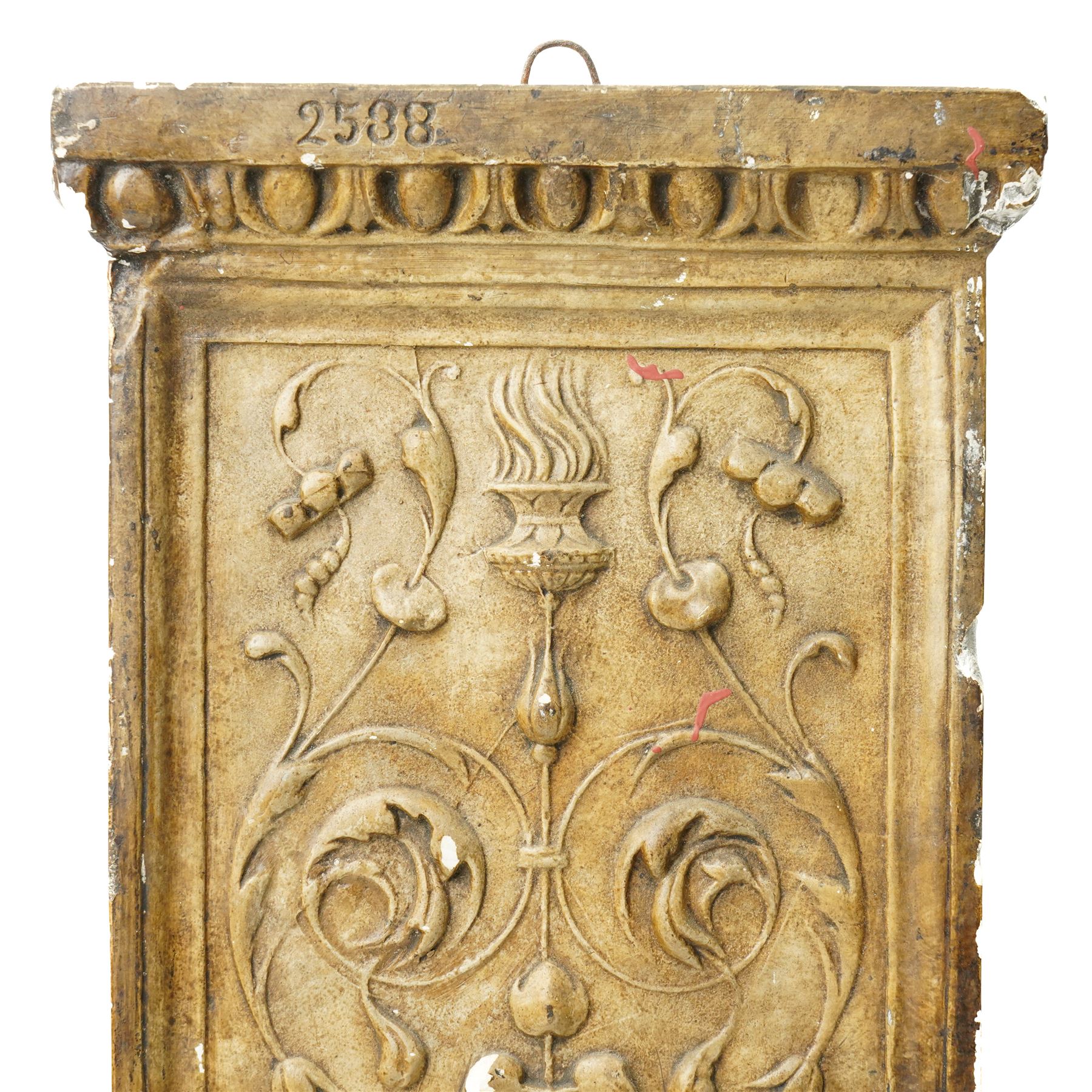 D Brucciani, London - After the antique -  A relief moulded plaster panel No2538 with stylised trailing leaves, flower heads and a mask 62cm x 22cm