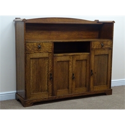  Arts & Crafts oak sideboard, raised arched back with single shelf, above two drawers, four cupboards and a recess, with brass ring handles, on shaped bracket feet, W155cm, H127cm, D42cm  