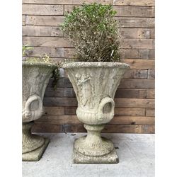 Set of four Victorian design cast stone Grecian urns, tapering form cast with figures and handles, square plinth bases