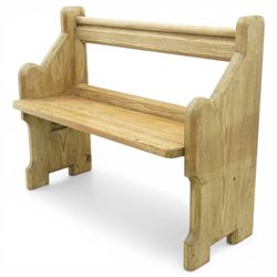 19th century pine pew of small proportions, open rectangular back with panelled frame, rounded top rail and plank seat, shaped slab ends with chamfered detail