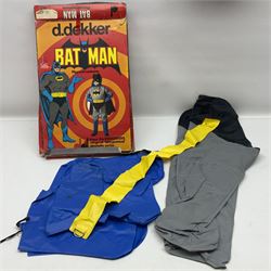 Two Boxed Batman Playsuit Costumes - 1960s 20th Century Original Play Suit, black eye mask, plastic vinyl cape/gauntlets, leather style belt, blue/yellow shirt, with Bat motif and blue/yellow pants; in original illustrated lidded box; and 1976 Decker Batman Playsuit costume, vinyl cape/ mask/gloves/boot tops/yellow belt, grey cloth top and pants; in original illustrated box (2)