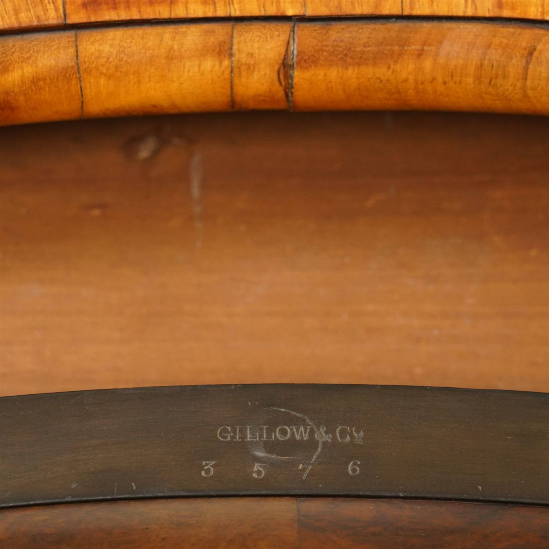 Gillow & Company (1862-1897) - Victorian figured walnut kidney shaped writing table, the shaped top inset with oxblood leather writing surface with embossed edge, surrounded by banded burr-walnut and crossbanding with moulded edge, fitted with single shaped frieze drawer flanked by scalloped side-aprons, raised on tapering and chamfered cabriole supports embellished with ormolu mounts in the forms of maidens over tapering acanthus leaves, the mounts trailing down the front of the legs to terminate to ormolu scroll feet, stamped 'Gillow & Co 3576' to drawer interior