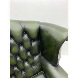Georgian style wing back armchair upholstered in green buttoned leather 