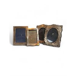 Four silver mounted photograph frames, including Edwardian pair with C scroll and reed and ribbon borders, hallmarked Henry Matthews, Birmingham 1908, tallest H18cm