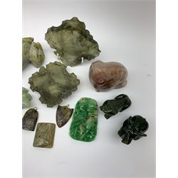 A group of jade, soapstone and hardstone, to include a jade pendant, jade frog, three soapstone pendants, nephrite jade elephant and frog, two soapstone trinket dishes modelled as leaves, etc. 
