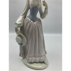 Two Lladro figures, comprising Eloise no 5005 and Picture Perfect no 7612, largest example H42cm