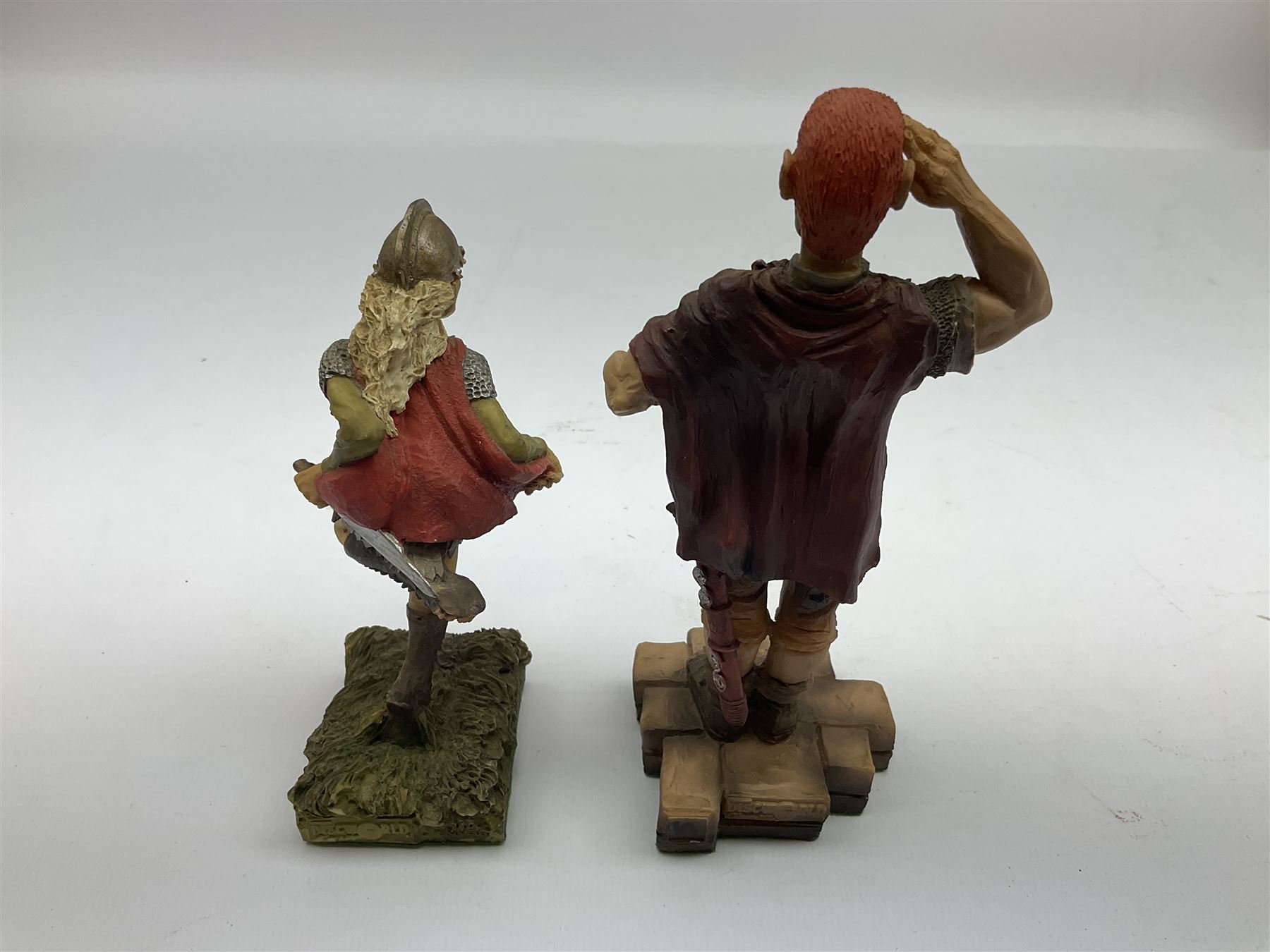 Terry Pratchett Discworld figures, designed by Clarecraft, comprising Captain Vimes DW54, in box, Angua DW66, in box, Angua as a wolf DW102, Sergeant Colon DW30, Corporal Nobbs DW80, Captain Carrot DW100, Cuddy the Dwarf DW106, together with a Tourist Guide to Lancre a Discworld Mapp