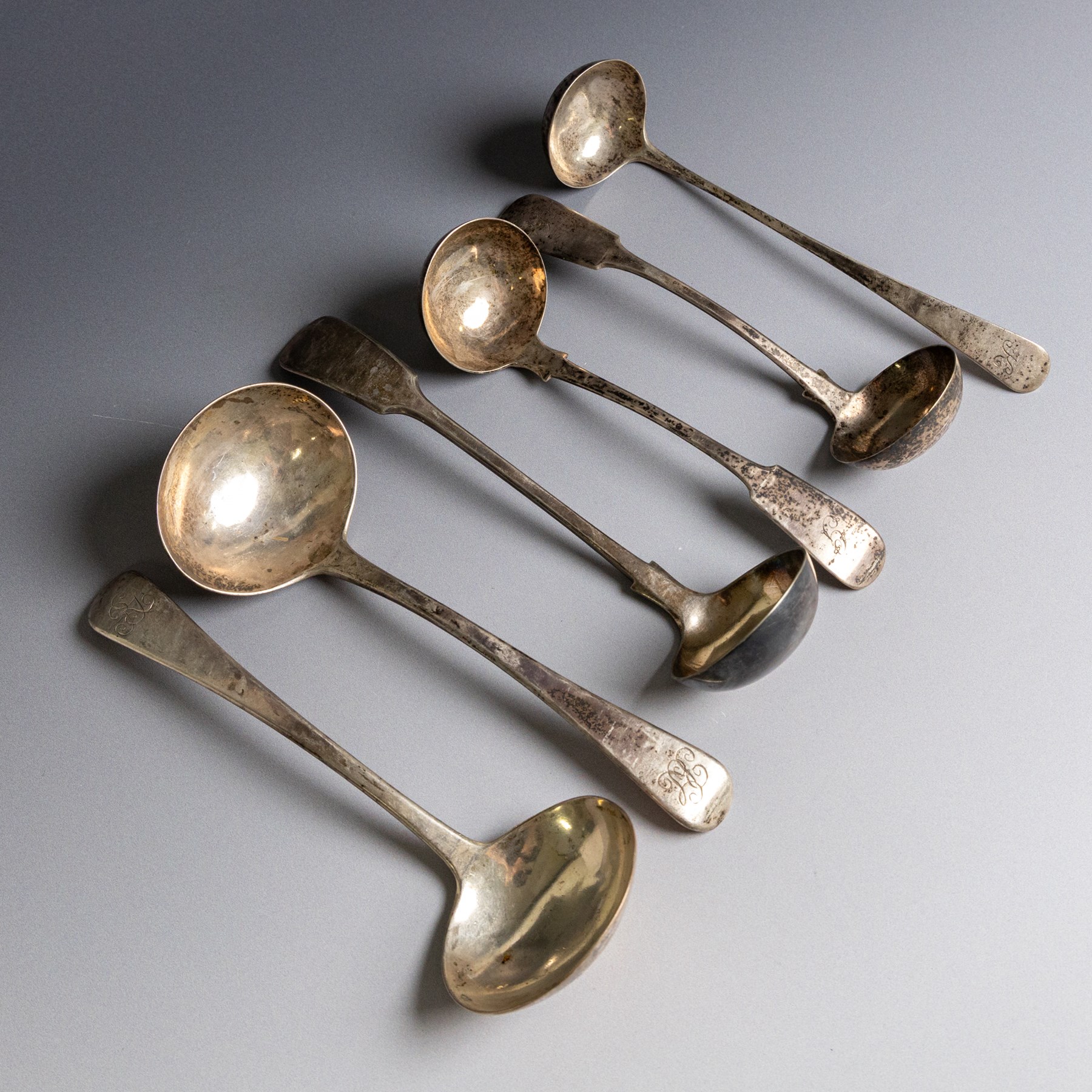 Six 19th century silver sauce ladles, comprising George III pair with engraved monogram to terminal, hallmarked Richard Crossley & George Smith IV, London 1807, pair of Scottish silver Fiddle pattern examples with engraved initials, hallmarked Marshall & Sons, Edinburgh 1836 and two other, both hallmarked