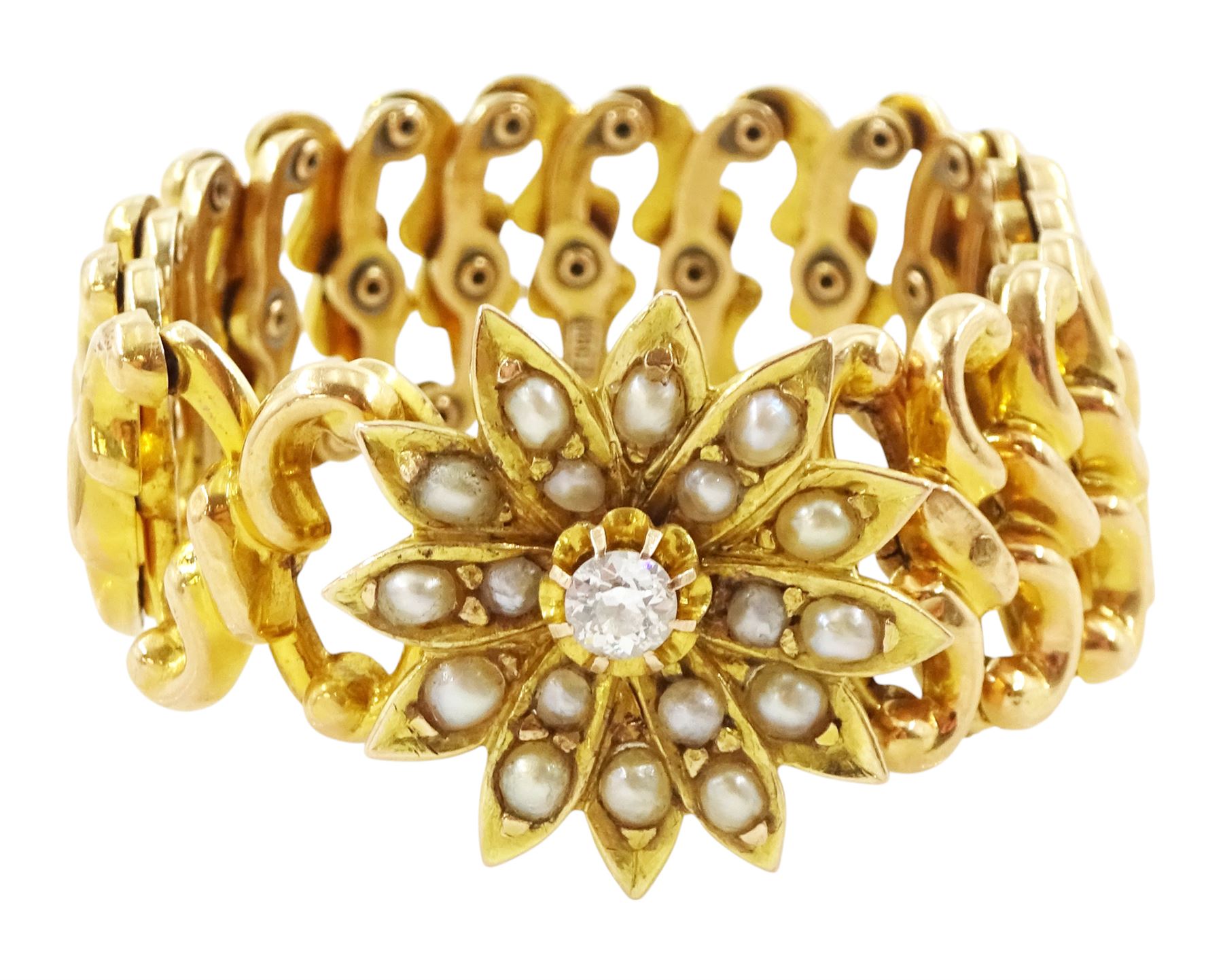 Victorian gold pearl and diamond expanding bracelet, the flower head centrepiece set with a single old cut diamond of approx 0.20 carat, with split pearl surround, on an expanding bracelet, stamped 18ct