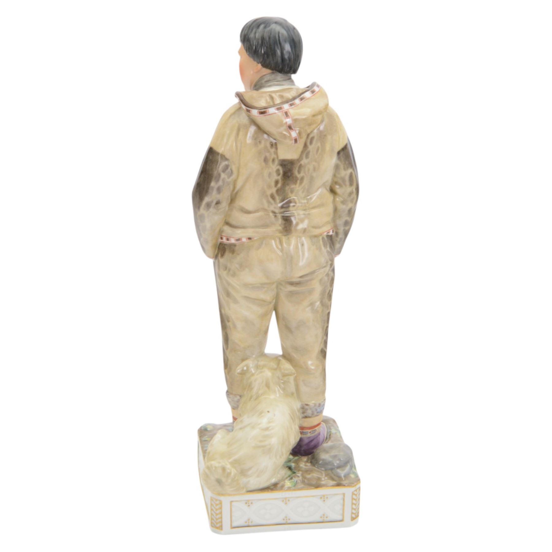 Royal Copenhagen Greenlandic figures, Man with Sledge dog by Carl Martin-Hansen, no.12225, with printed mark beneath, H32cm