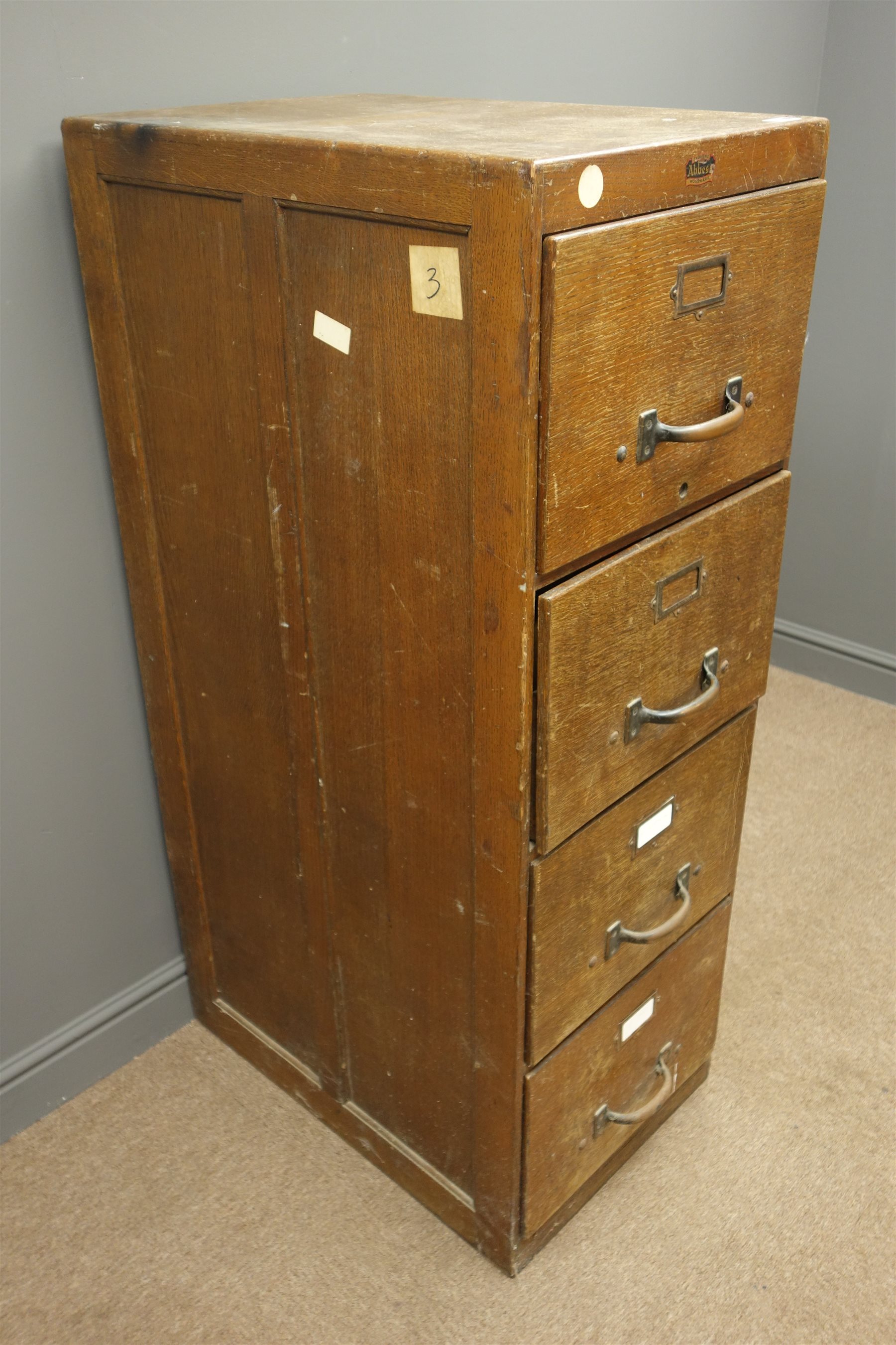 Early 20th century 'Abbess' oak four drawer filing brass pull