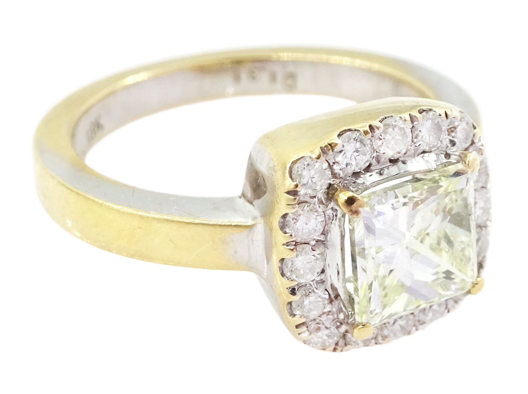 18ct gold diamond cluster ring, the central princess cut light yellow diamond of approx 1.00 carat, with round brilliant cut white diamond surround, total diamond weight 1.31 carat