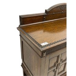 Early 20th century oak sideboard, raised stepped arch back over moulded rectangular top, fitted with two drawers and two panelled cupboards with geometric mouldings, on turned and lobe carved baluster feet united by stretchers 
