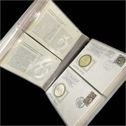 Thirty-six 'International Society of Postmasters Official Commemorative Issues' sterling silver proof medallic covers dating from 1975 to1977, housed in the official folder