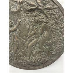 Late 19th century bronze plaque, of circular form, depicting the angel appearing to Adam and Eve in the garden of Eden in high relief, D25.5cm
