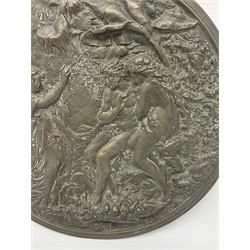 Late 19th century bronze plaque, of circular form, depicting the angel appearing to Adam and Eve in the garden of Eden in high relief, D25.5cm
