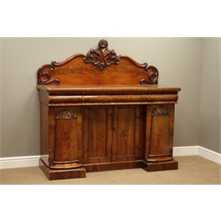  Small Victorian mahogany sideboard, raised figured book matched back with carved scroll mounts, three drawers above double and two single cupboards, plinth base, W152cm, H145cm, D56cm  