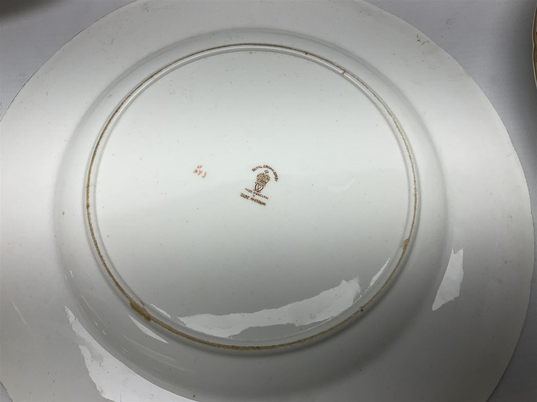 Five early 20th century Royal Crown Derby Olde Avesbury pattern dinner plates, decorated with oriental pheasants, butterflies and other birds amongst flowering branches, with impressed and printed marks to reverse, D26.5cm