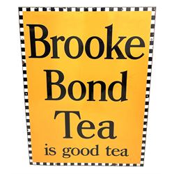 A large enamel advertising sign for Brooke Bond tea, detailed 'Brooke Bond Tea is good tea' in black lettering upon an orange ground with black and white chequered border, H101.5cm, W76cm. 