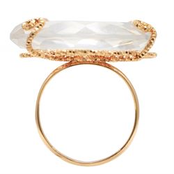 18ct gold rock crystal ring, single round cut crystal, mounted in a fancy textured swirl under setting, stamped 750