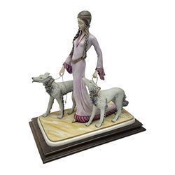 Capodimonte figure Ester, modelled of a lady with two dogs, upon a stepped wooden base, H45cm
