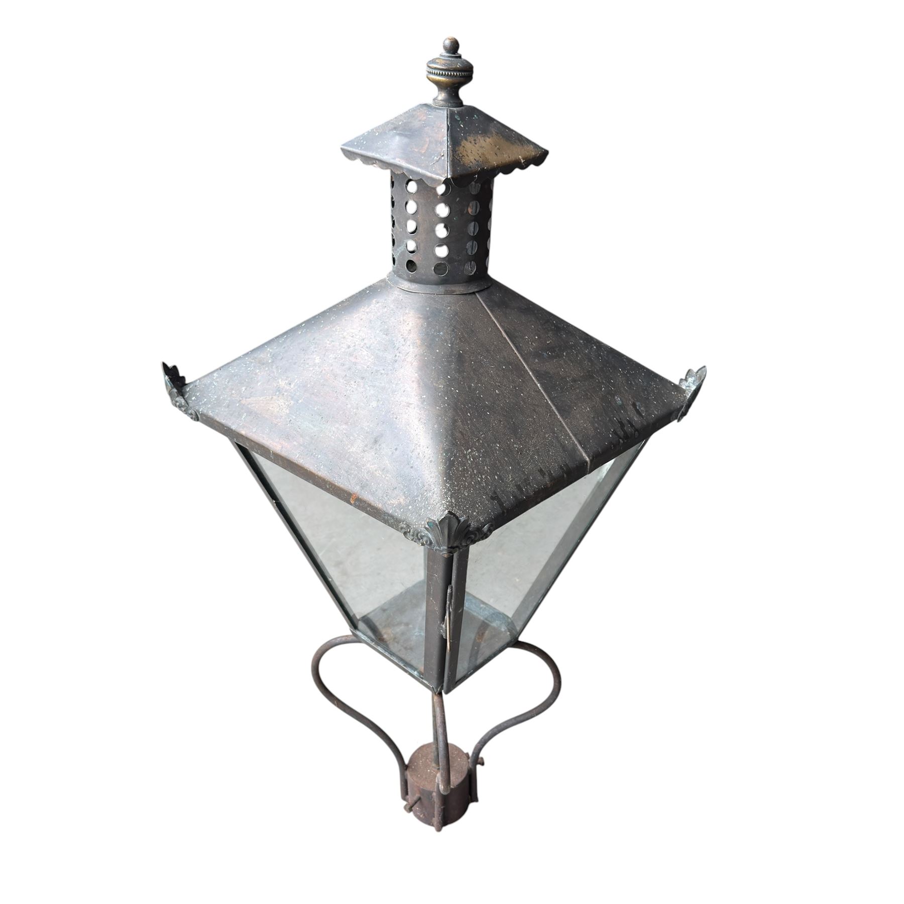 Early 20th century brass and cast iron garden lantern or street light, turned finial over four panel glazed body, cast iron base