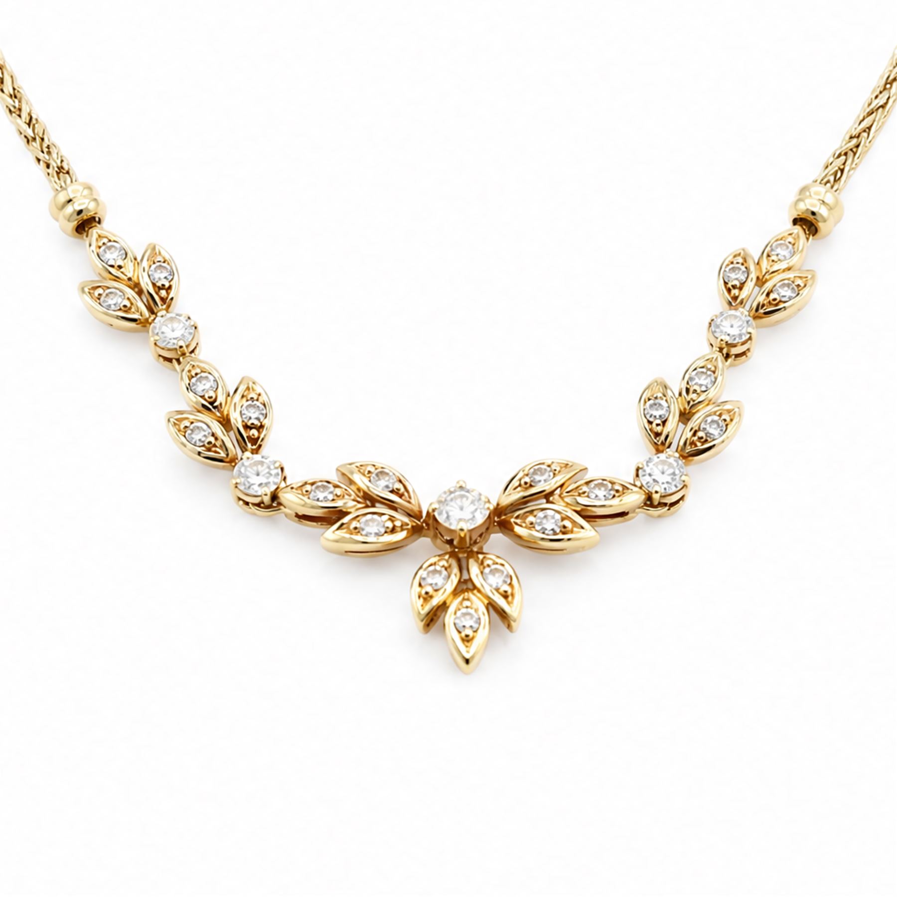 18ct gold diamond floral design necklace, five round brilliant cut diamonds, each spaced by leaf design links set with diamonds, to a Spiga link chain, Sheffield import mark 1989, total diamond weight approx 0.75 carat