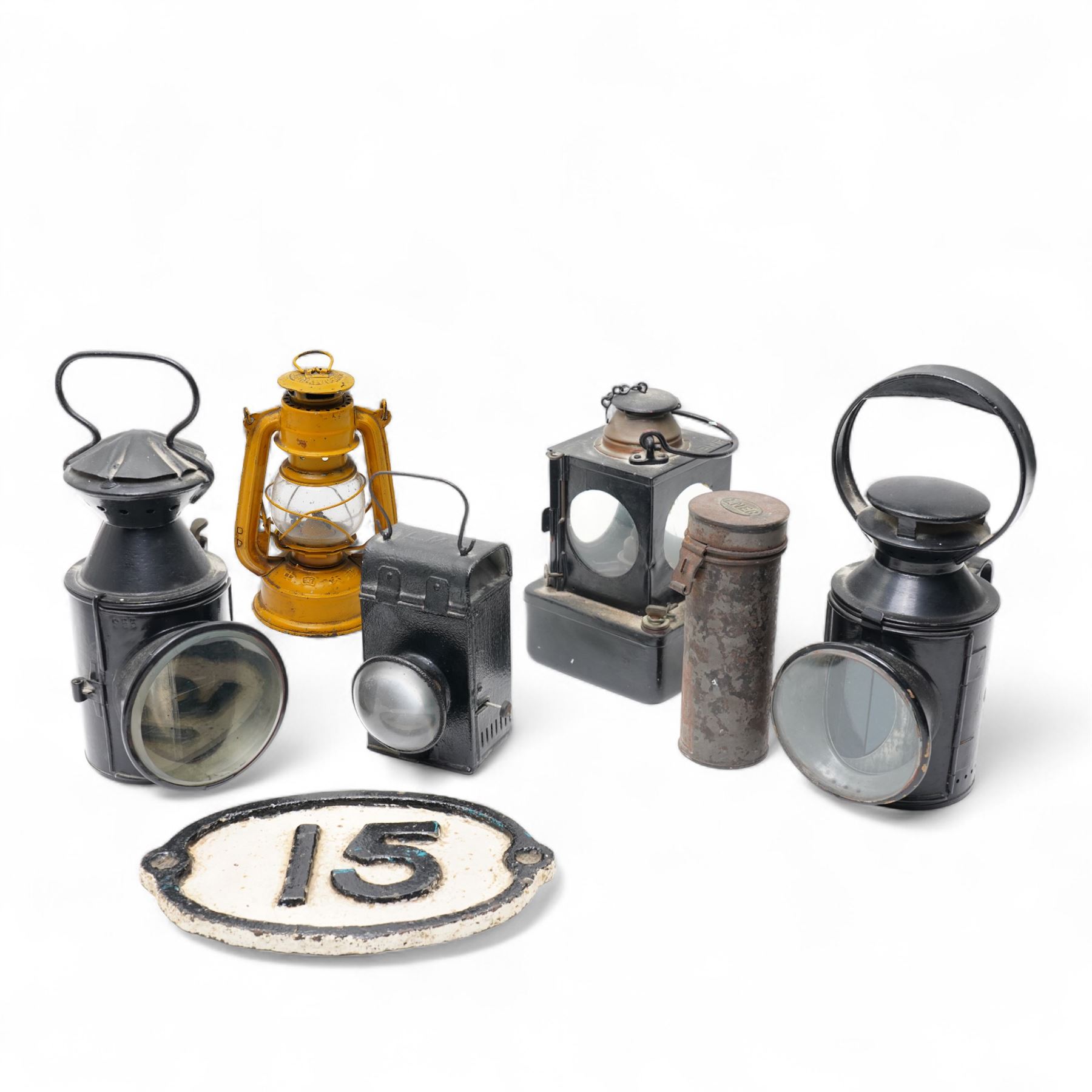 LNER Welch patent international signals lamp No711206, LMS lamp with bullseye lens, B.R.(M) lamp, another railway lamp, oval plate'15' and an LNER tin