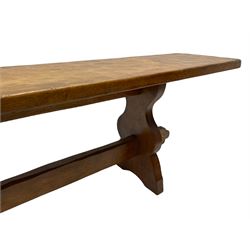 Gnomeman - adzed oak narrow bench, rectangular seat on shaped end supports united by pegged stretcher, carved with gnome signature, by Thomas Whittaker, Little Beck 