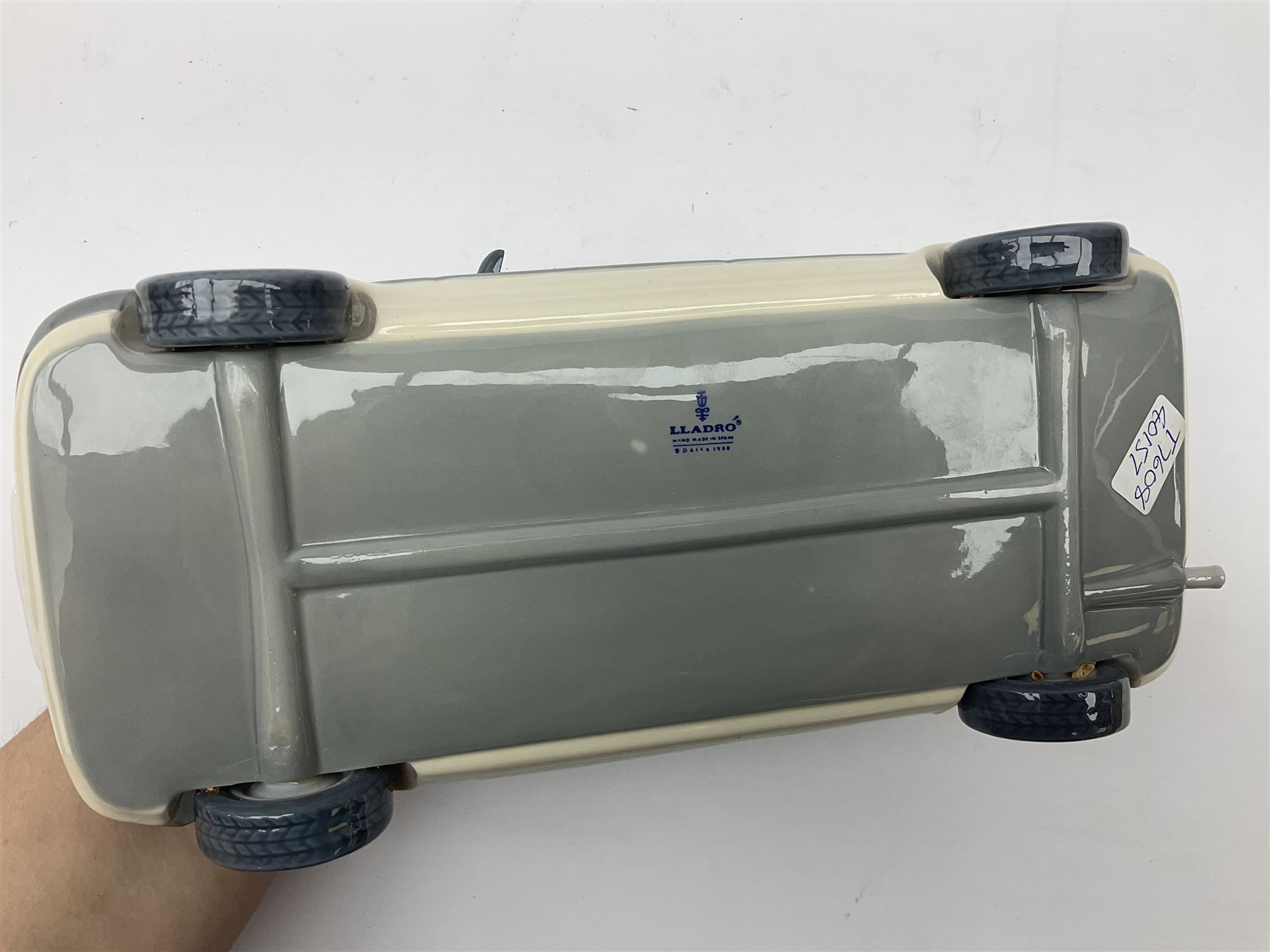 Lladro figure, Ford Fiesta, modelled as a Ford in beige, special commission by the Ford factory in Valencia, original box, no 7608, year issued 1989, year retired 1989, H9cm 