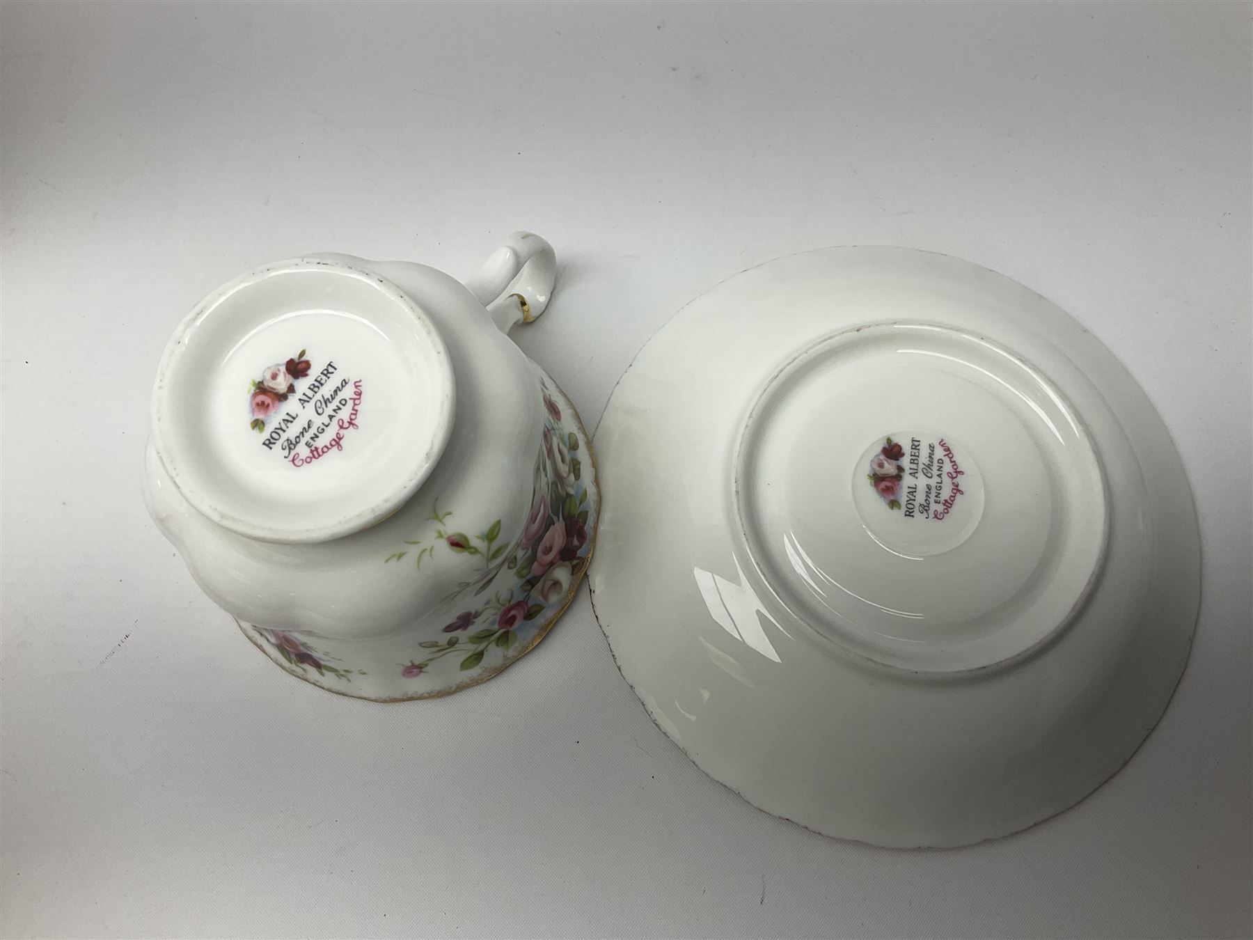 Royal Albert Cottage Garden pattern tea service for six people, comprising teapot, milk jug, sugar bowl, teacups and saucers, side plates and cake plate, all with printed mark beneath