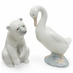 A group of eight Nao figures, together with one Lladro Polar Bear figure, each with printed mark beneath (9)