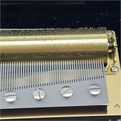 Reuge Sainte-Croix- 21st century Swiss musical box with a highly polished lacquered finish, inlaid and ebonised case with a glazed internal viewing lid, polished steel 144 teeth two-part comb playing three arias from The Phantom of the Opera by Lloyd Webber, with tune indicator and tune sheet.