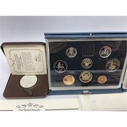 Three The Royal Mint United Kingdom proof coin collections dated 1983, 1984 and 1986, Queen Elizabeth II Turks and Caicos Islands 1980 20 crown silver proof piedfort coin cased with certificate, two five pound coin covers, 1998 NHS fifty pence coin cover and various other coin covers