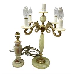  20th century gilt metal and onyx four branched candelabra upon a circular base, and onyx table lamp in the form of an urn, tallest example H48cm